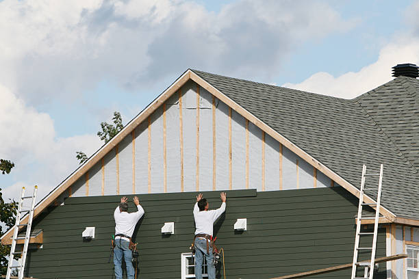 Professional Storm Damage Siding Repair technician working in Wayne, IL